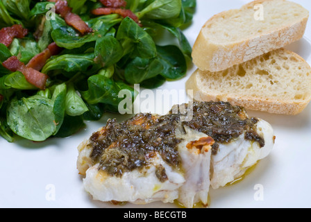 Sea-Devil fish (Lophius piscatorius) with with algae tartar and field salad (Valerianella locusta) with roasted bacon strips an
