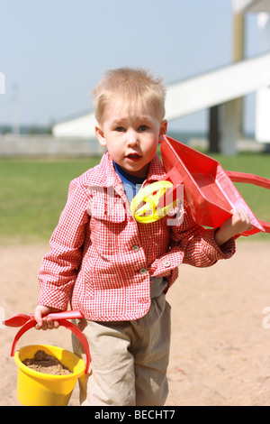 Let's build the house! The child bears building stock. Stock Photo