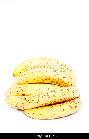 A bunch of bananas with browning skin on a white background Stock Photo