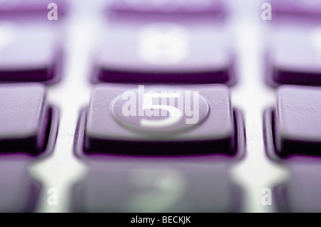 Close-up of a calculator keypad with focus on number 5 Stock Photo