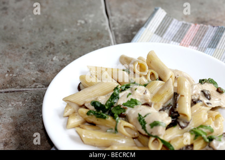 Italian Style Roast Chicken and Wild Mushroom And Spinach Pasta Meal With No People Stock Photo
