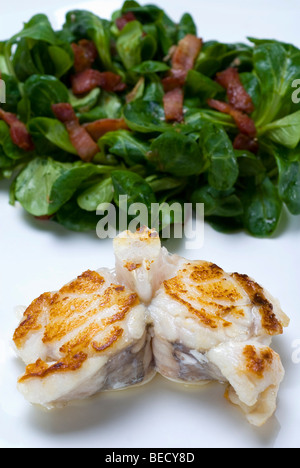Sea-Devil fish (Lophius piscatorius) and field salad (Valerianella locusta) with roasted bacon strips