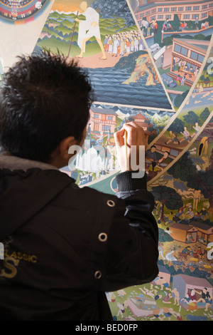 Tibetan Exile Thangka Artisan Stock Photo