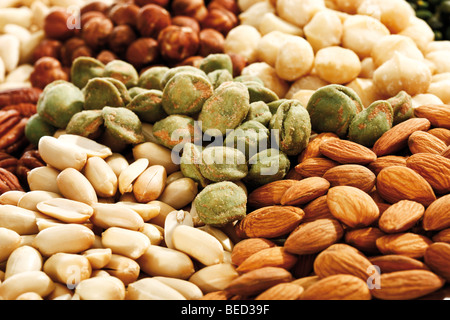 Mixed nuts, full format, peanuts, salted pistachios, hazelnuts, macadamia nuts, almonds Stock Photo