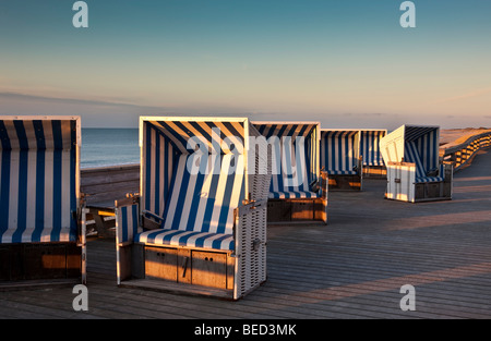 Roofed wicker beach chairs in the evening sun near Kampen, Sylt Island, North Frisian Islands, Schleswig-Holstein, Germany, Eur Stock Photo