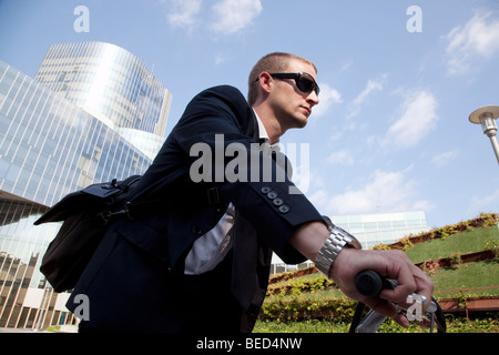 Business man on the move on his bicycle Stock Photo