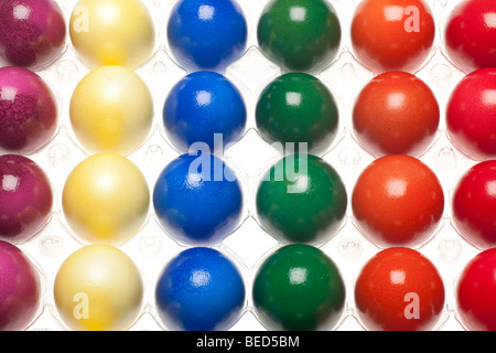 30 dyed easter eggs in six different colours in six rows Stock Photo