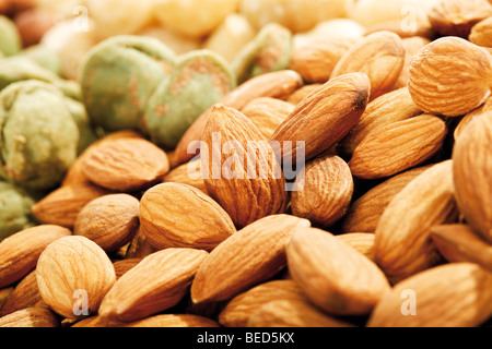 Mixed nuts, full format, peanuts, salted pistachios, almonds Stock Photo