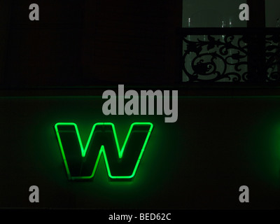 Letter W of a neon sign at night Stock Photo