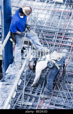 High angle view of two construction workers working at a construction site Stock Photo