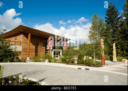 Totem poles in front of the Lil'wat Native Cultural Centre. Whistler BC, Canada Stock Photo