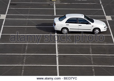 Single White car in Carpark Stock Photo