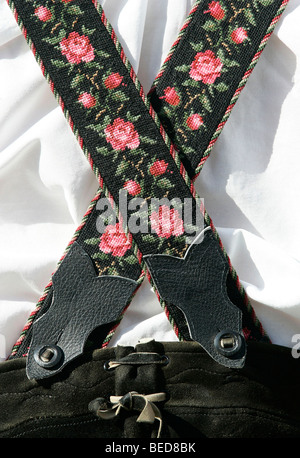 Embroidery and decorations on the suspenders of Lederhosen, traditional Bavarian leather trousers, in Seehausen on Staffelsee L Stock Photo
