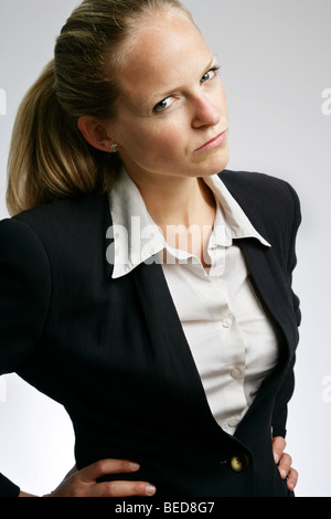 Angry young business woman Stock Photo