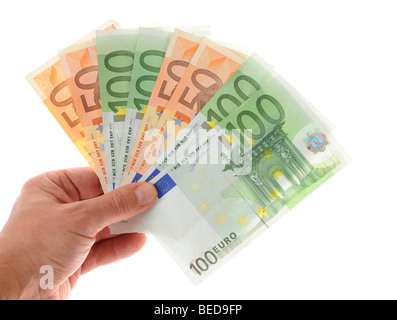 Hand holding a fan of banknotes Stock Photo