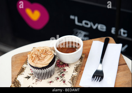 A peanut butter Cup cake and espresso coffee in Heart Buchanan deli and cafe on Byres Road in the West End of Glasgow, Scotland. Stock Photo