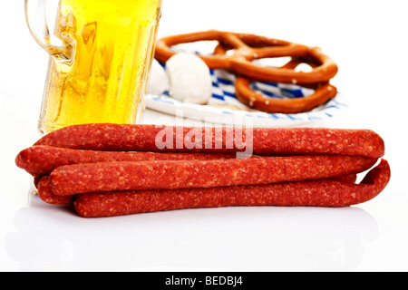 Ham Mettwurst sausages with beer, veal sausages and salted pretzels, Bavarian Stock Photo