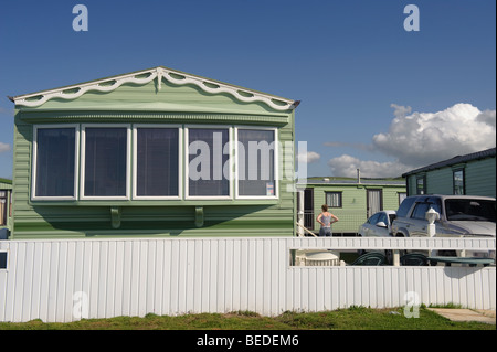 Green static caravans mobile homes trailers on a campsite in Tywyn Gwynedd north wales UK Stock Photo