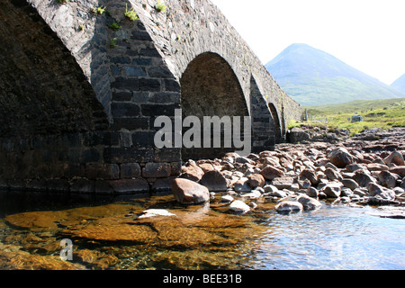 The old bridge Sligachan River, with Glamaig beyond in the Red Hills, Isle of Skye, Scotland Stock Photo