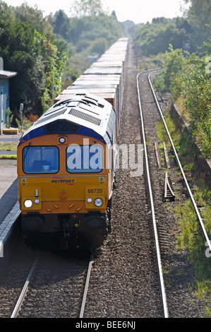 Metronet freight train, coming out of the south rail freight terminal, Trimley, Felixstowe, Suffolk, UK. Stock Photo