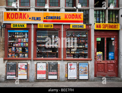 Mini supermarket selling alcohol and Kodak film shop window Ghent Belgium Stock Photo