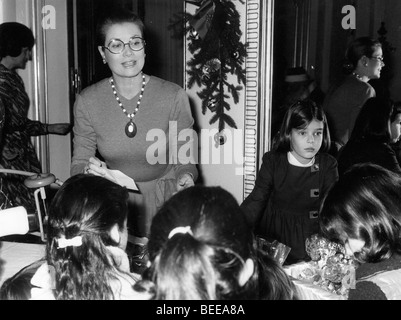 Grace Kelly, Princess of Monaco, left, and her daughter Caroline, Princess of Hanover, at a holiday party. Stock Photo