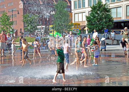 Kids playing in fountain on a hot day, Boston, Massachusetts, USA Stock Photo