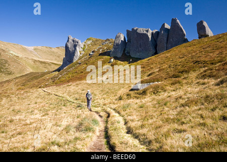 A lone hiker in the Sancy Massif (Puy de Dôme - France). Randonneur solitaire dans le Massif du Sancy (Puy-de-Dôme - France). Stock Photo
