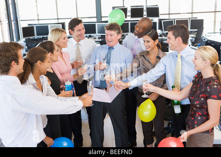 Stock Traders Celebrating In The Office Stock Photo