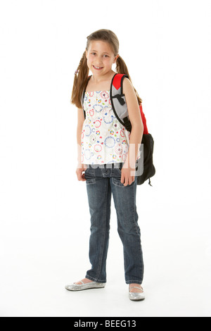 Studio portrait of girl carrying backpack Stock Photo - Alamy