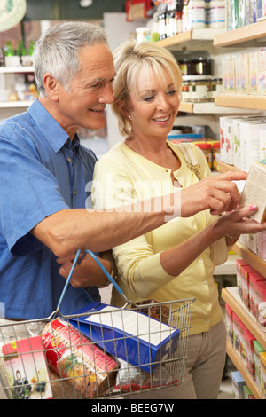 Middle aged couple buying herbal tea Stock Photo