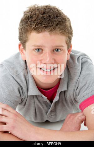 Teenage Boy Laying on Stomach Stock Photo