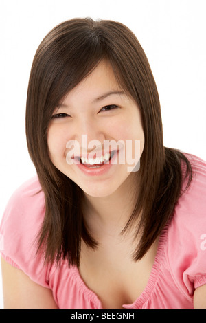 Studio Portrait of Smiling Teenage Girl Stock Photo