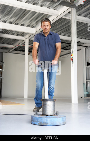 Cleaner polishing office floor Stock Photo