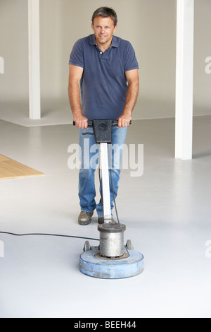 Cleaner polishing office floor Stock Photo