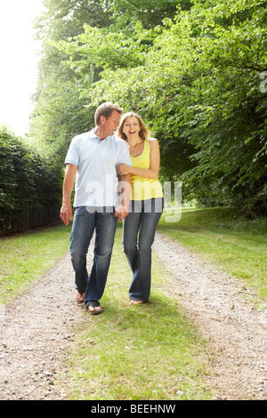 Middle aged couple walking in countryside Stock Photo