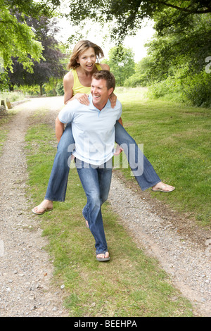 Young couple having fun in countryside Stock Photo