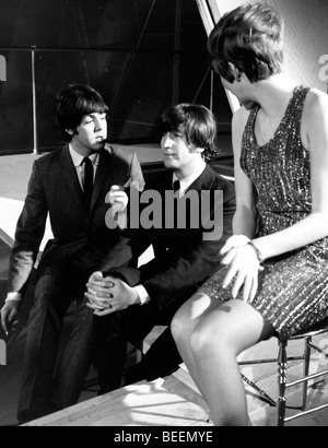 The Beatles with Cilla Black taking a break from filming a TV special Stock Photo