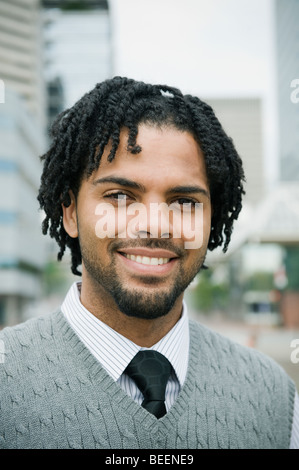 Mixed race businessman smiling Stock Photo
