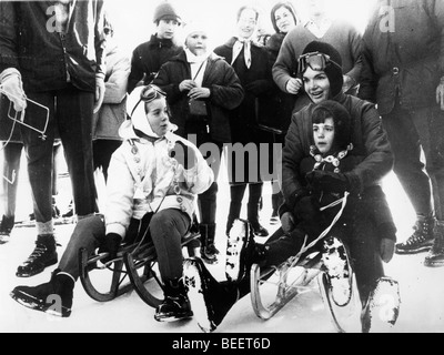 First Lady Jackie Kennedy sled rides with her children Stock Photo