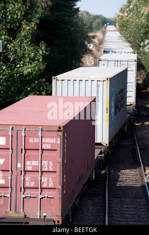 Single Stack Container Train Freight train. Cargo containers transportation by railway. Impoert ...