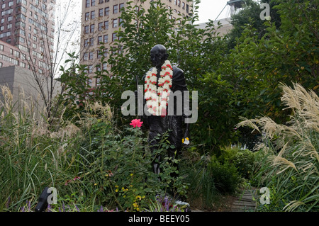 The Mahatma Gandhi statue in New York is hung with garlands on Friday, October 2, 2009 for his birthday Stock Photo