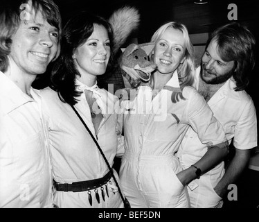 ABBA in white jumpsuits in the mid-1970's (L-R) Björn Ulvaeus, Anni-Frid Lyngstad (Frida), Agnetha Fältskog, and Benny Andersson Stock Photo