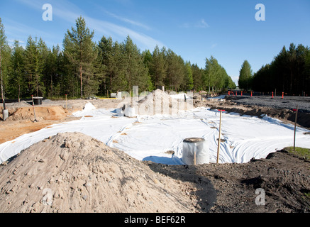 Installation of drainage system and the frost protection using sheets of fiberglass fabric , Finland Stock Photo
