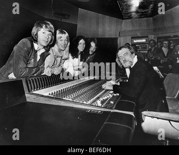 ABBA in a recording studio in the mid-1970's (L-R) Björn Ulvaeus, Agnetha Fältskog, Anni-Frid Lyngstad, and Benny Andersson. Stock Photo