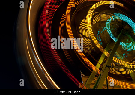 Ferris wheel in motion close up of light streaks Evergreen State Fair Monroe Washington State USA Stock Photo