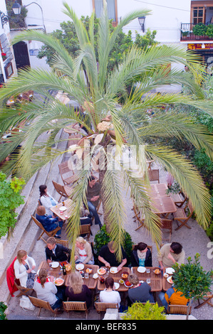 people eating outside in square Spain Stock Photo