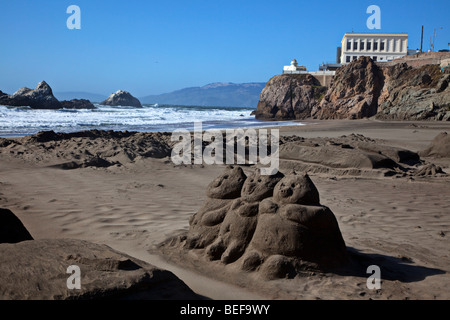 Three little pigs sand sculpture and Cliff House, Ocean Beach, San Francisco, California Stock Photo