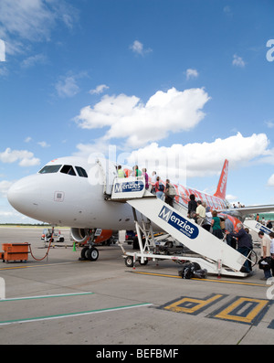 Passengers boarding an Easyjet plane at Stansted airport, UK