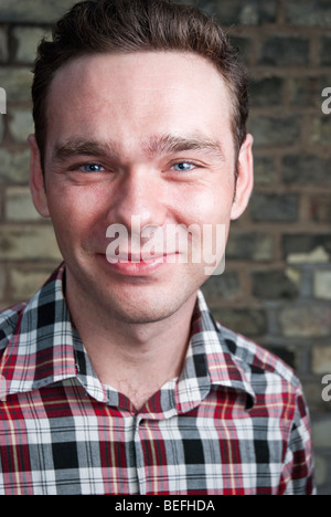 Headshot of young man smiling. Stock Photo